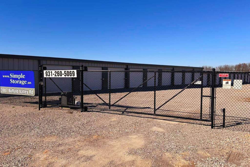 Black controlled entry and gate operator fence for storage building by Cloyd's Fencing