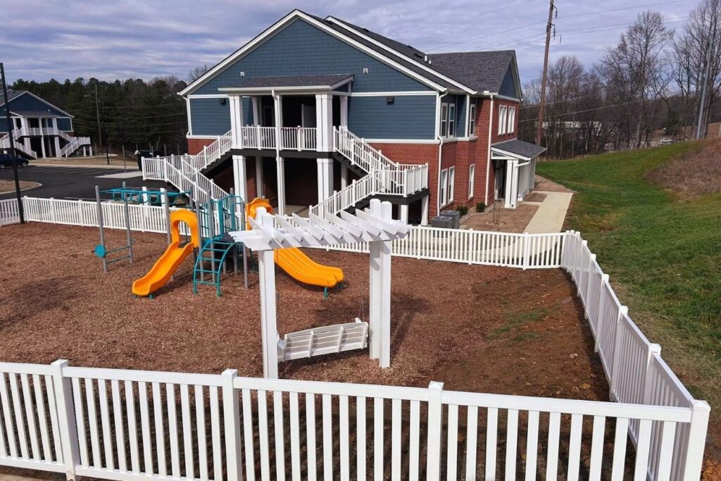 vinyl fence for apartment complex playground by Cloyd's Fencing